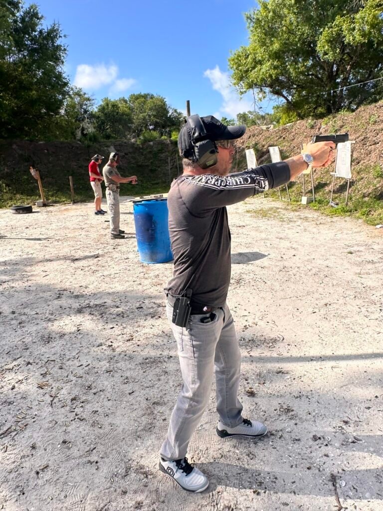 Student practicing a concealed carry draw at the range