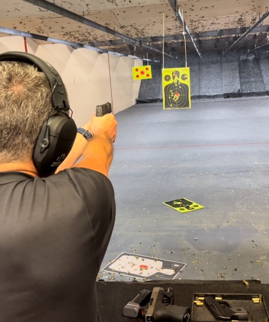 Student during a Delray Beach shooting lesson at an indoor range