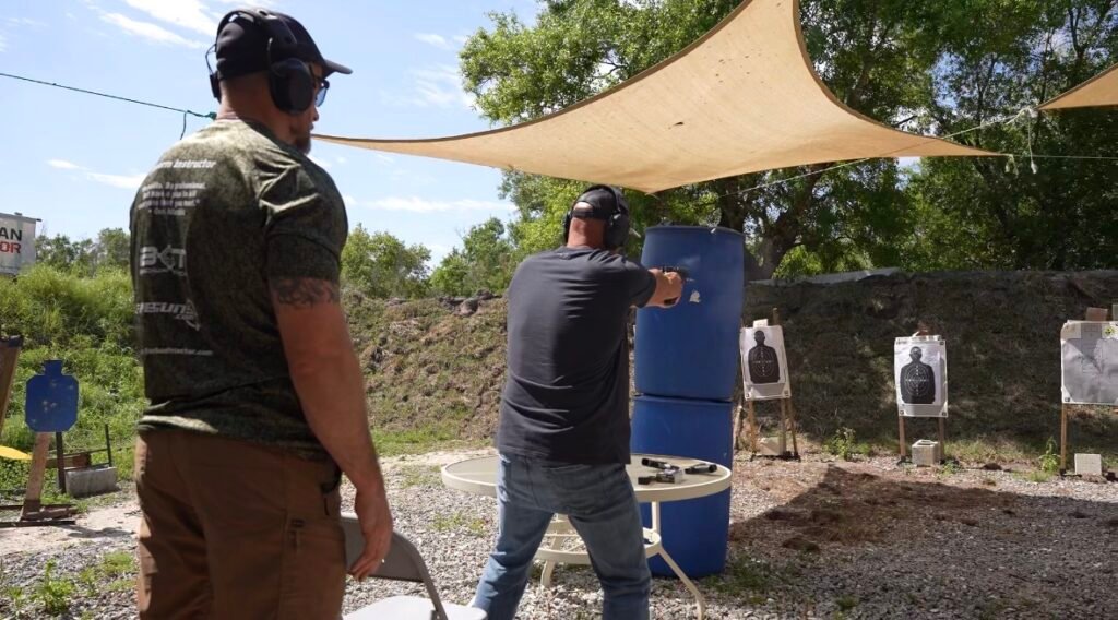 Instructor coaching a student at the Boynton Beach outdoor range