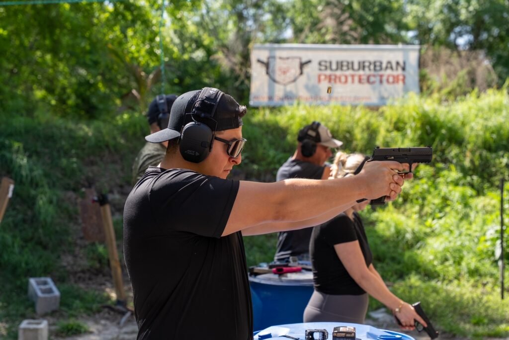 Student firing a pistol during a first shooting lesson