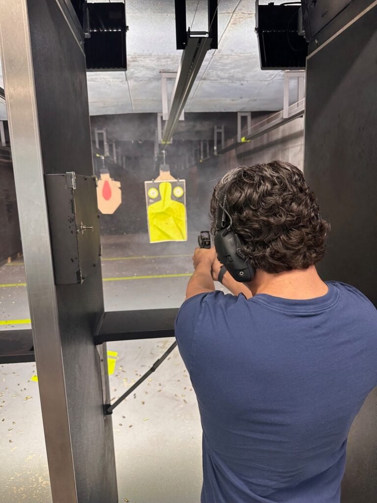 Student taking an indoor shooting lesson near Delray Beach