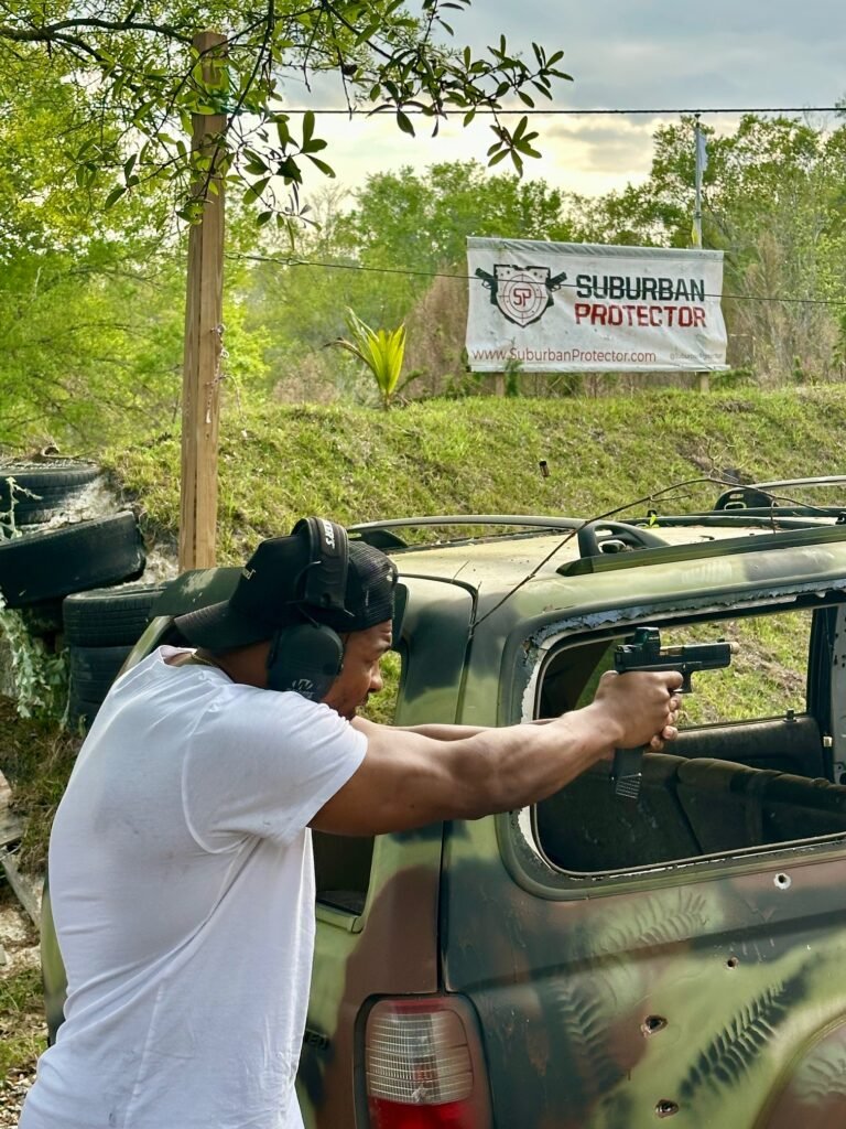 Student shooting a pistol at the outdoor range near Delray Beach