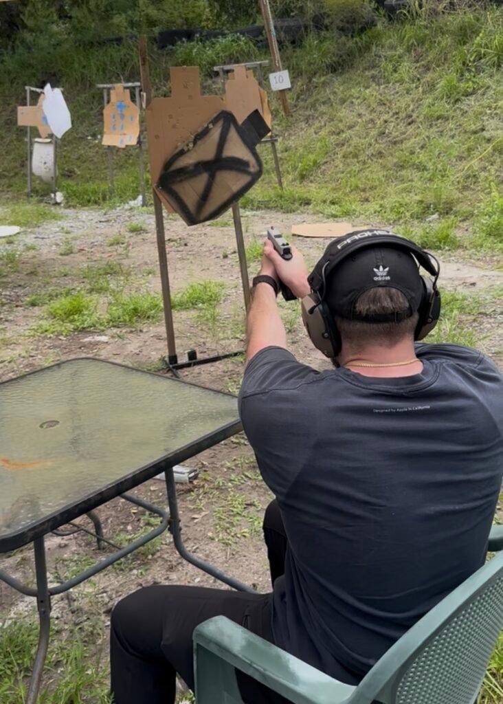 Private pistol coaching from a seated position at the range