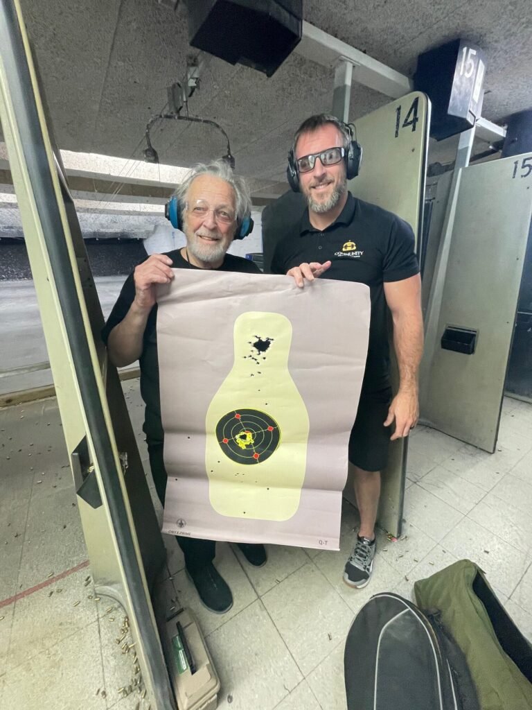 Private shooting lesson student reviewing a target with the instructor