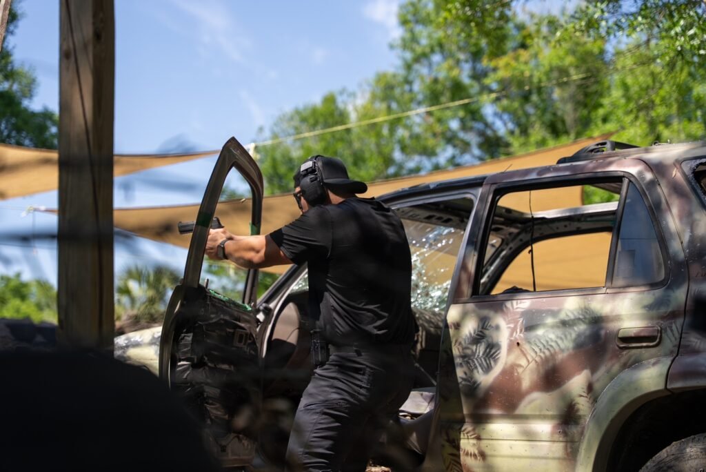 Protector Level 3 student training around a vehicle