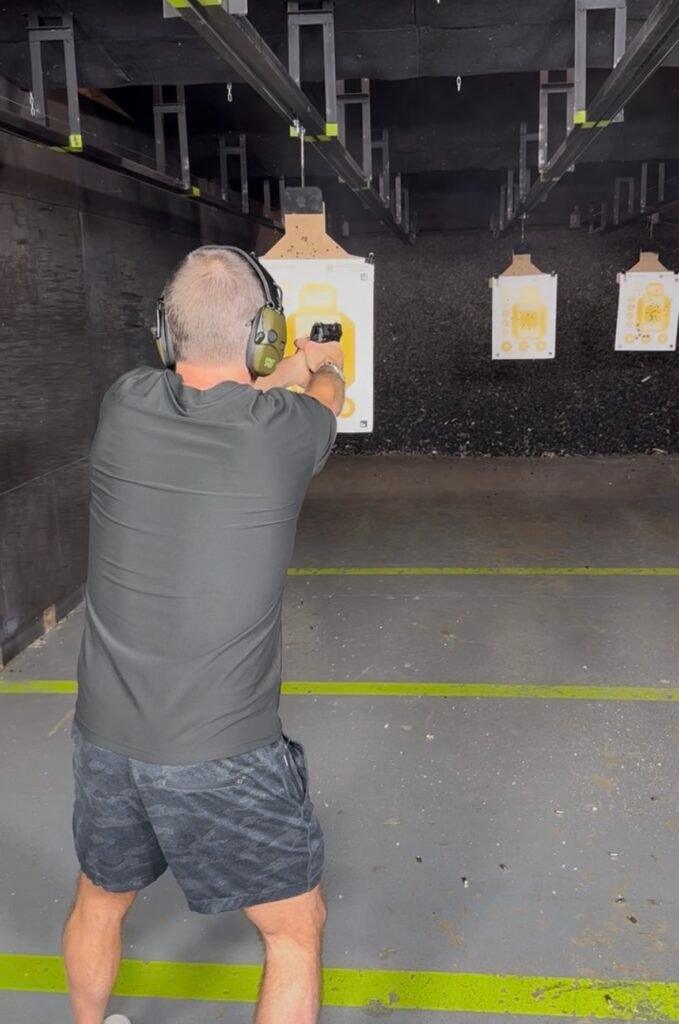 Security team member practicing at an indoor range