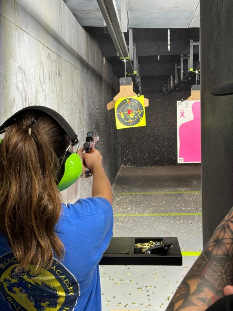 Woman shooting at an indoor range during a women-only lesson